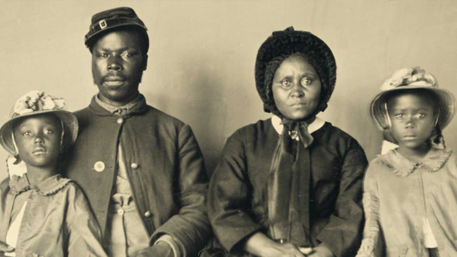 A Black Union soldier with his wife and two daughters taken in 1863