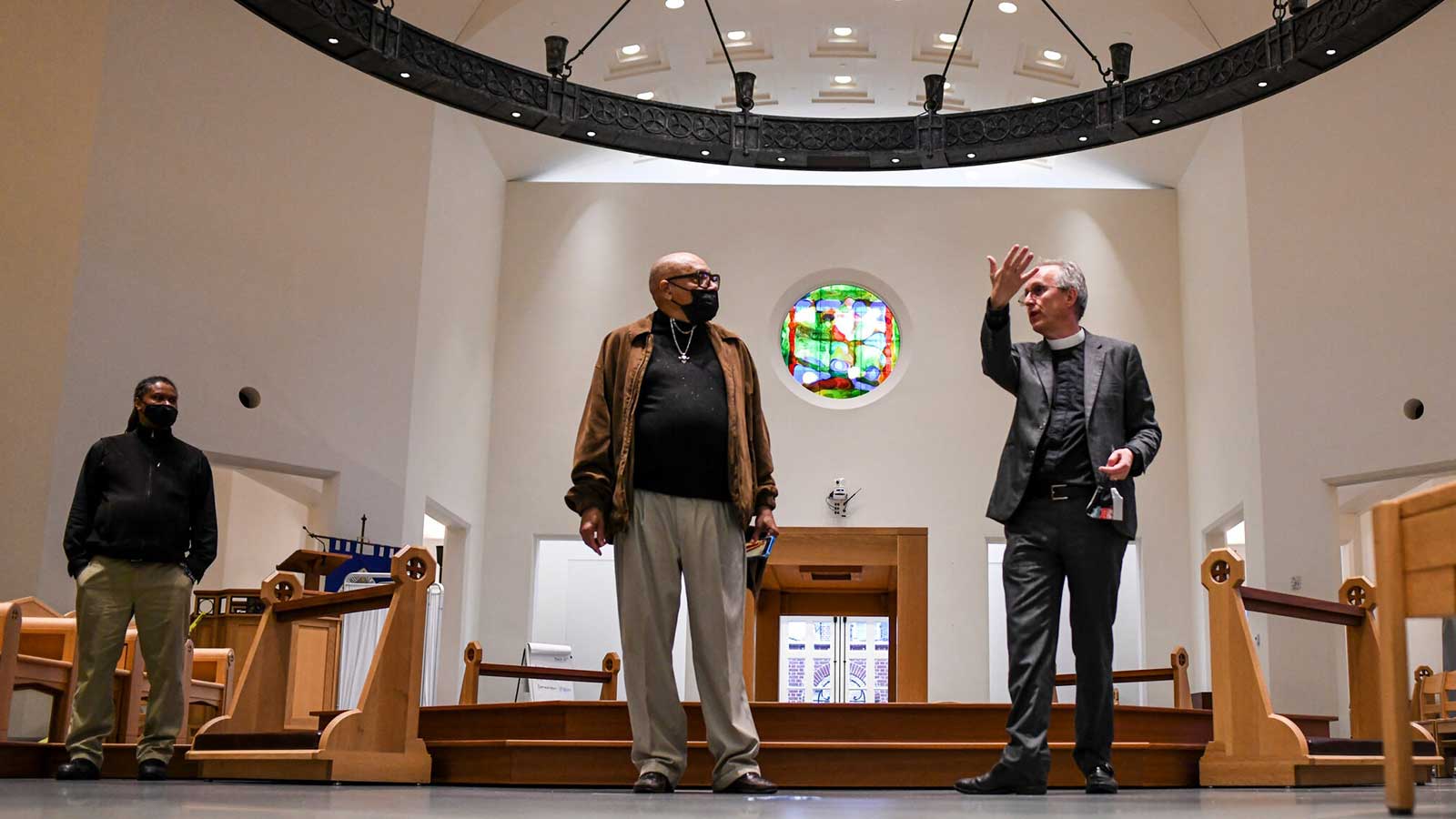 The Rev. Ian S. Markham, right, gives Gerald Wanzer a tour of the seminary campus