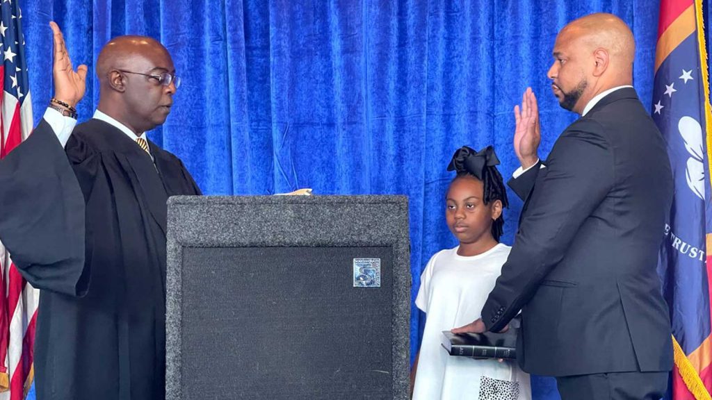 Hinds County Circuit Court Judge Winston Kidd (left) swore in the National Bar Association President Carlos Moore at the Capital Club in Jackson, Miss., on Tuesday, July 27, 2021.