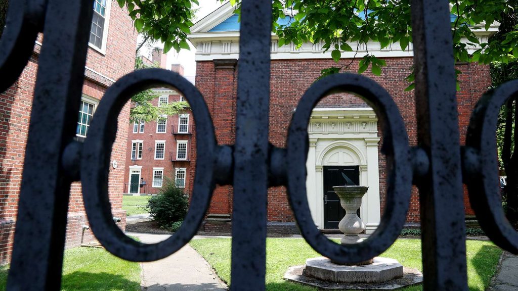 A view of a gate to Harvard Yard on the campus of Harvard University in July 2020.