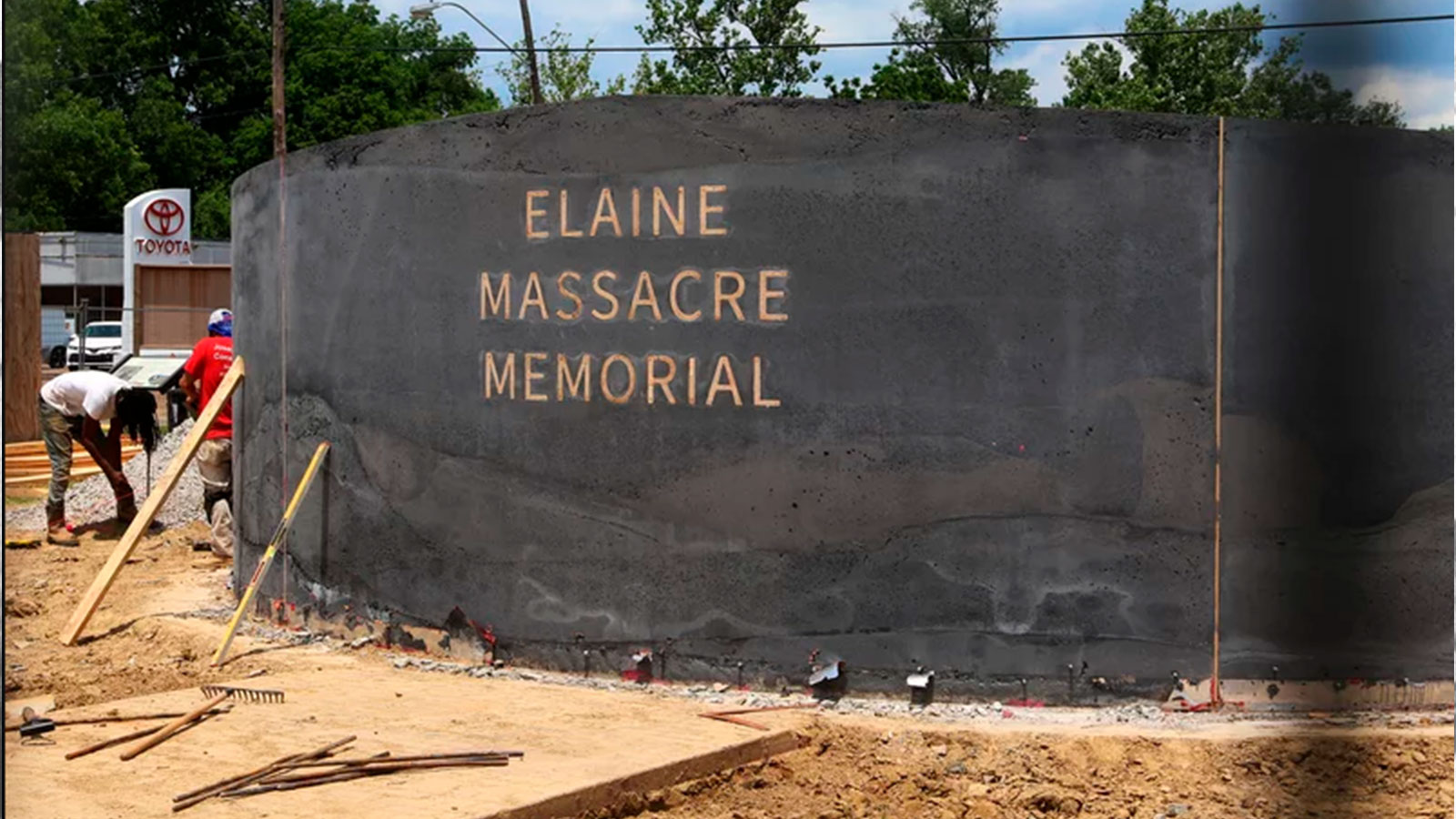 A construction crew works on the monument honoring victims of the Elaine massacre in Helena, Ark., on June 15, 2019. 