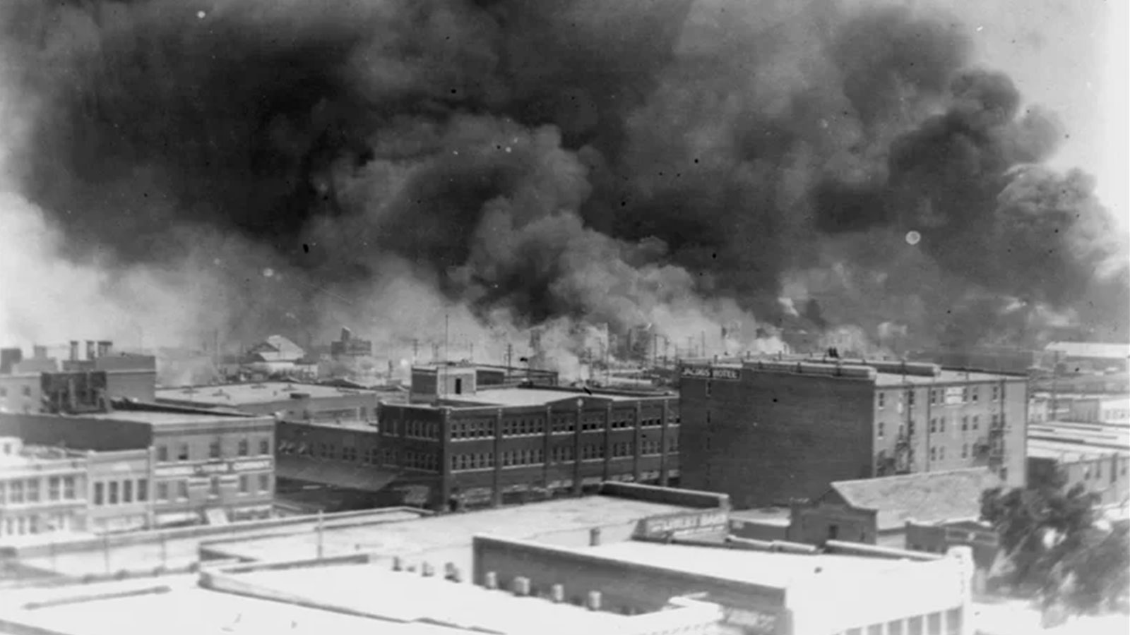 In this 1921 image provided by the Library of Congress, smoke billows over Tulsa, Okla., following the killing of hundreds of people in "Black Wall Street" in the city's prosperous Greenwood enclave.