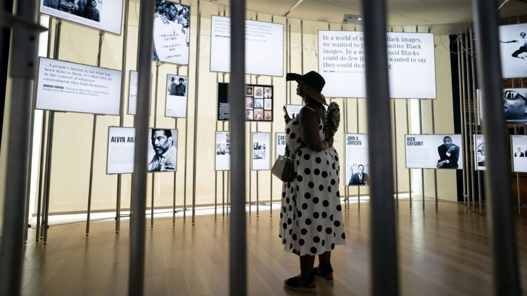 A woman looks at an exhibit at the International African American Museum on June 27 in Charleston, S.C.