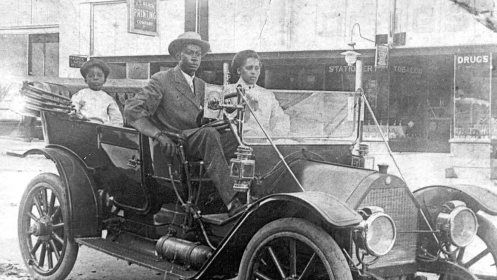 American businessman John Wesley Williams sits in his car with wife Loula Williams and their son, W.D. Williams in Tulsa in the 1910s. 