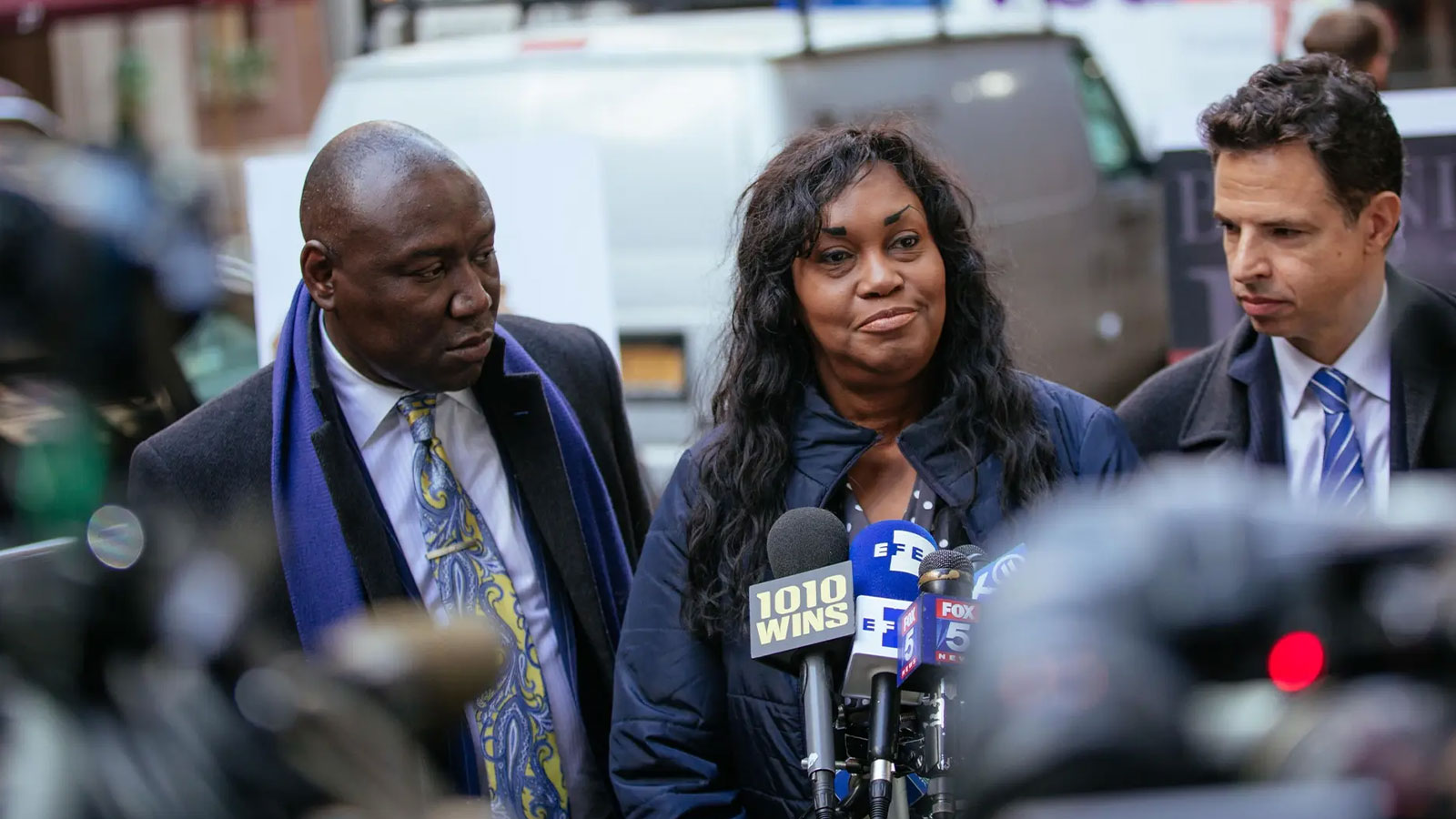 Lanier, center, speaks during a press conference announcing a lawsuit against Harvard University outside the Harvard Club of New York City in March 2019. 