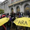 A crowd listens to speakers at a reparations rally outside City Hall in San Francisco on March 14, 2023.