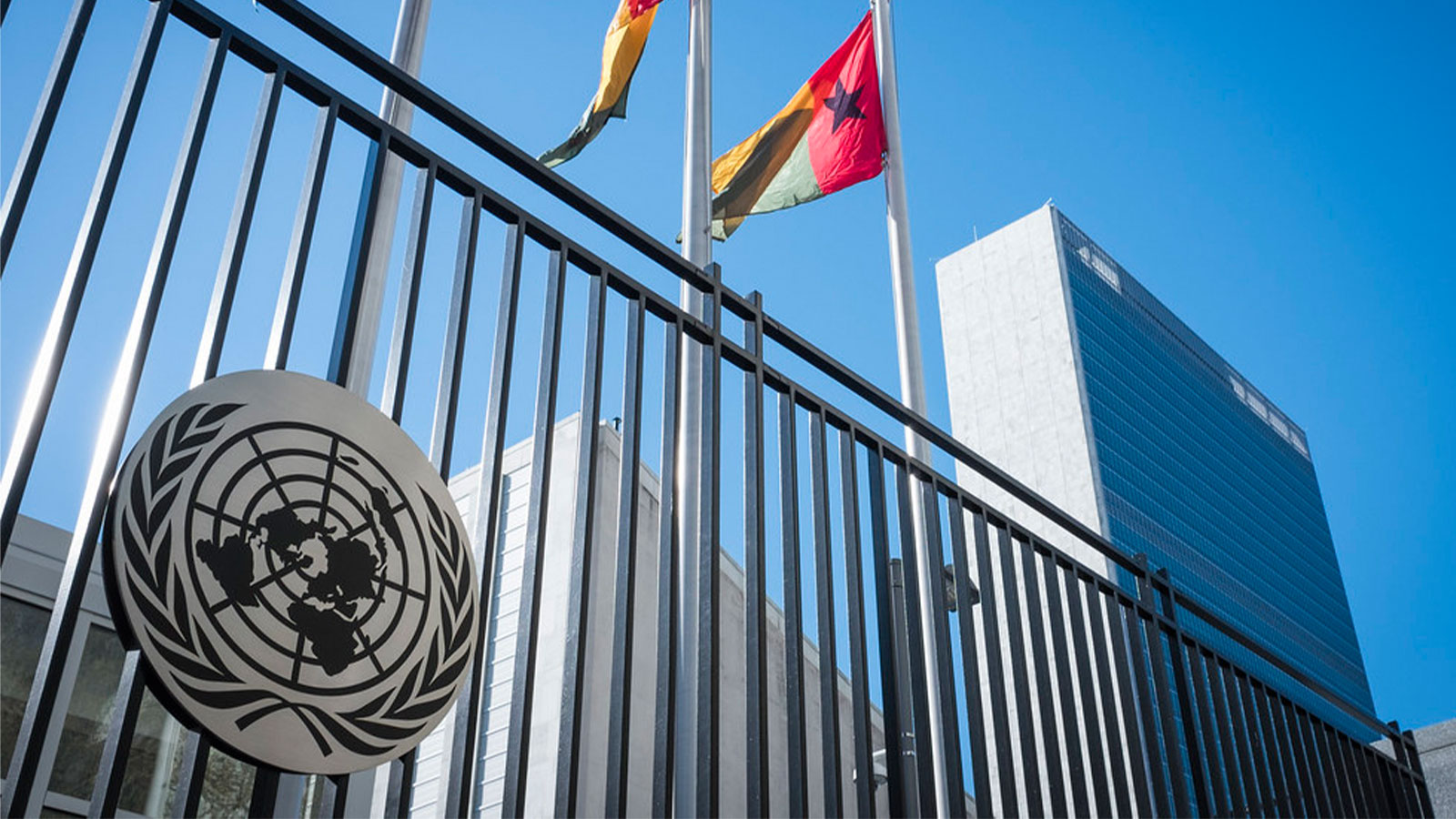 Image: A view of the United Nations (UN) Secretariat Headquarters Building and the flags of UN member states Guatemala, Guinea and Guinea-Bissau, taken from just outside the front gate on First Avenue in New York City. (UN Photo. Flickr)
